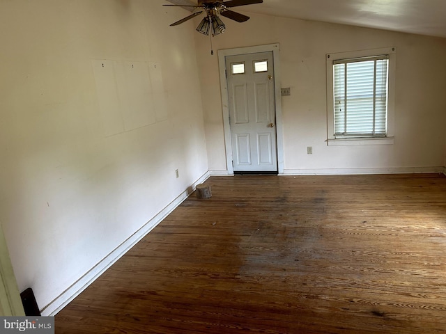 foyer featuring ceiling fan, vaulted ceiling, and dark hardwood / wood-style floors