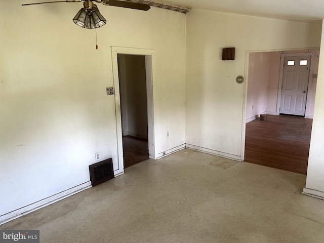 unfurnished room with lofted ceiling and ceiling fan