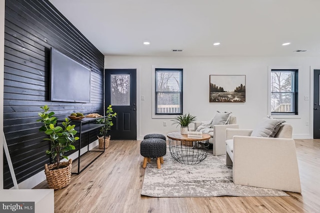 living room with light hardwood / wood-style flooring