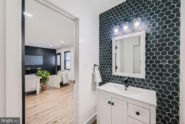 bathroom featuring hardwood / wood-style flooring and vanity