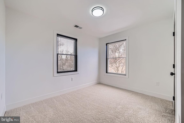 spare room featuring carpet floors