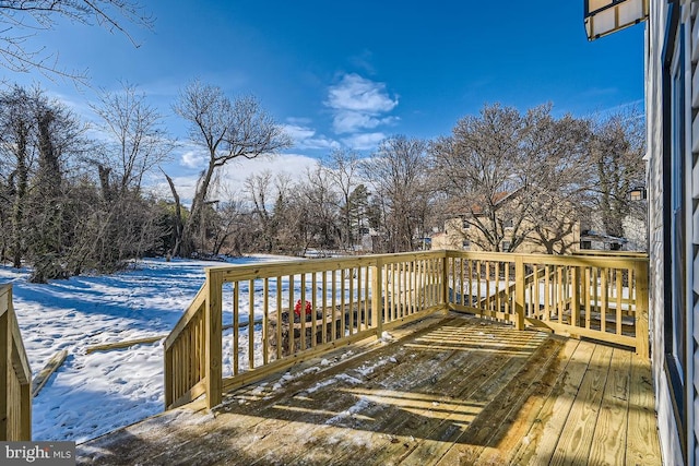 view of snow covered deck