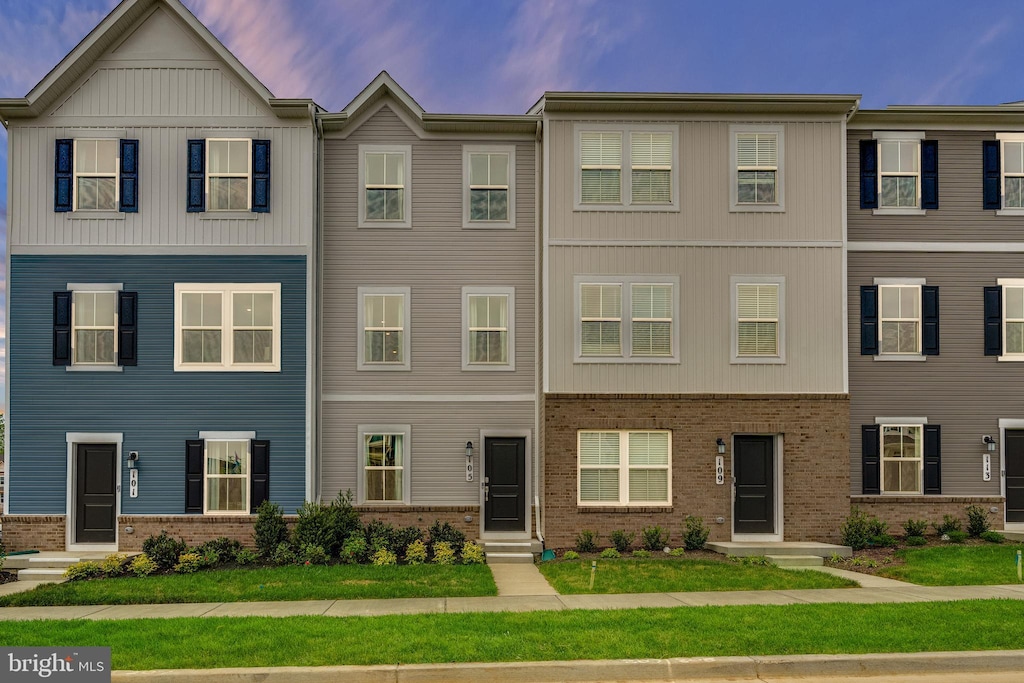 view of property with a lawn