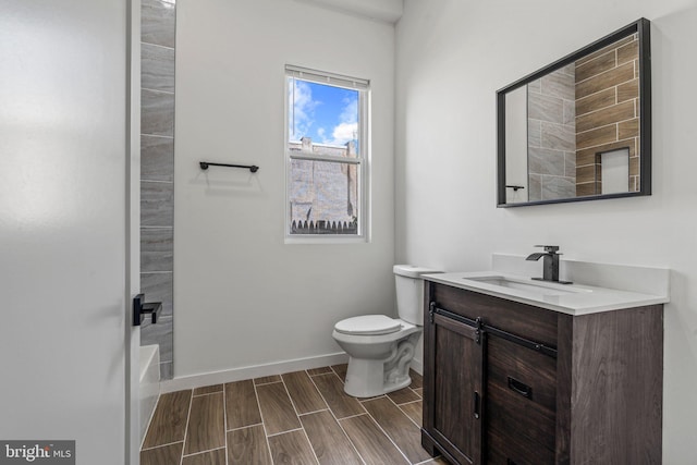 bathroom featuring toilet and vanity