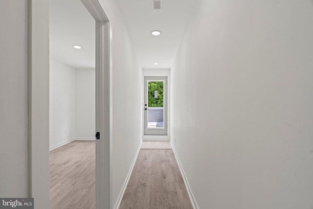 corridor featuring light hardwood / wood-style floors