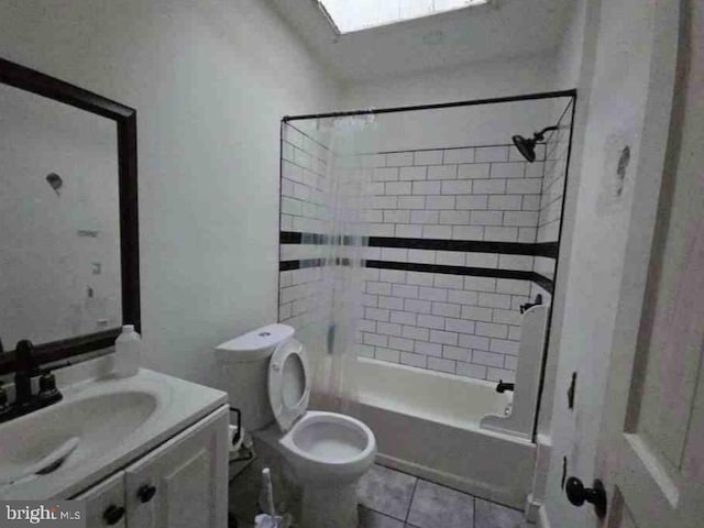 full bathroom with toilet, tile patterned flooring, vanity, and tiled shower / bath combo