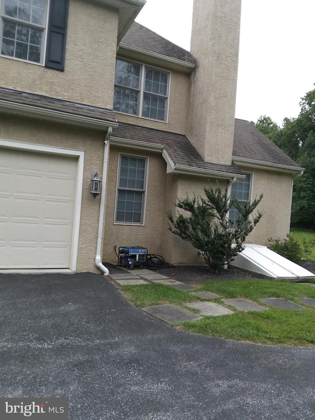 view of side of property featuring a garage