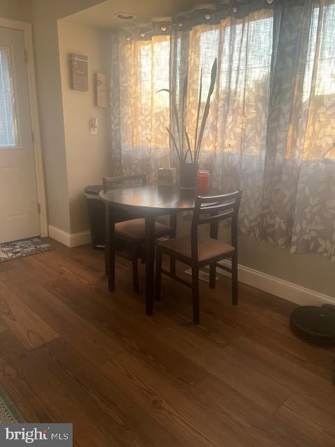 dining room featuring dark wood-type flooring