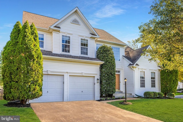 view of front facade featuring a garage and a front yard