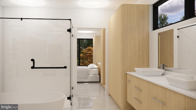 bathroom featuring vanity and a tub to relax in