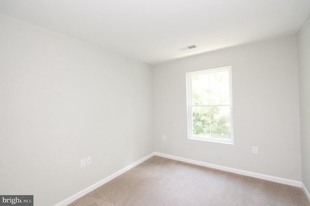 unfurnished room featuring carpet