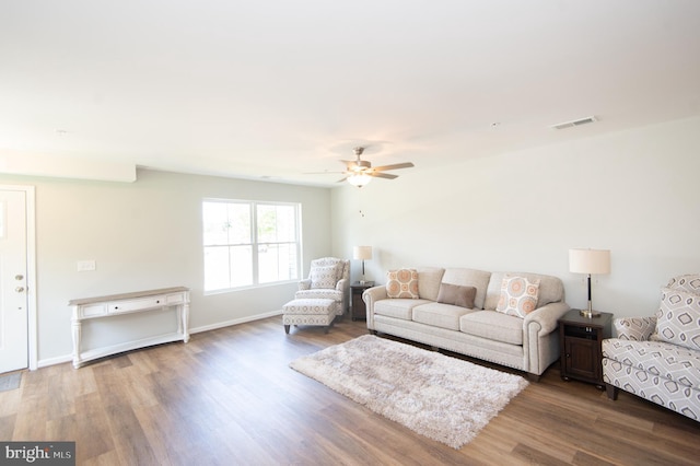 living room with ceiling fan and hardwood / wood-style floors