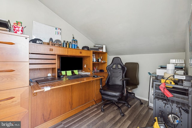 home office with vaulted ceiling and dark wood-type flooring