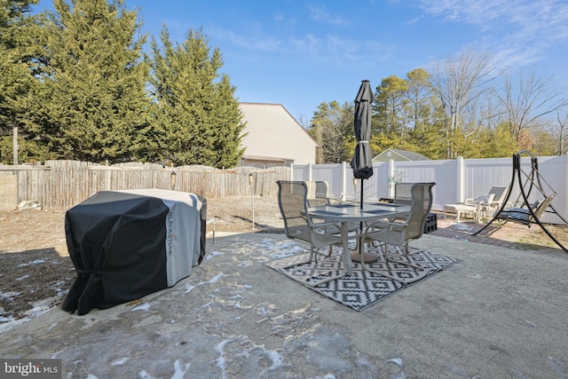 view of patio featuring a grill