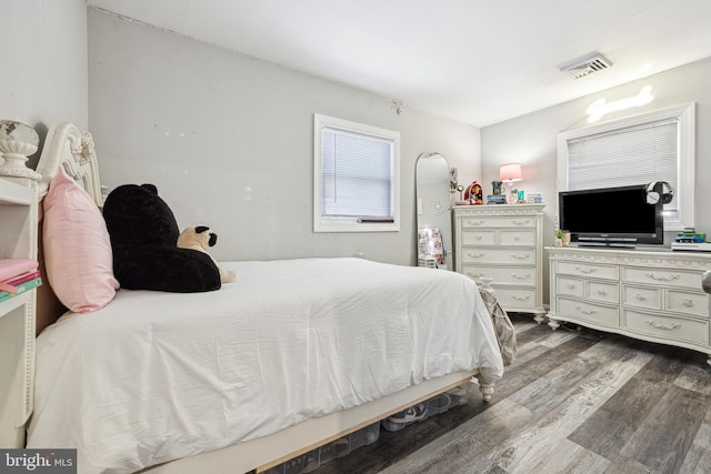 bedroom with hardwood / wood-style floors