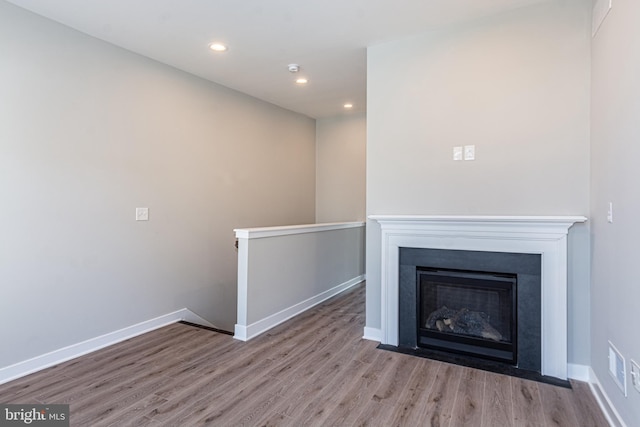 unfurnished living room with light wood-type flooring