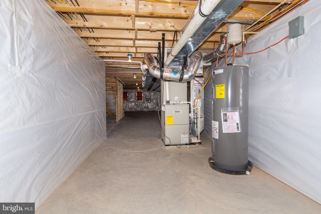 basement featuring electric water heater and heating unit