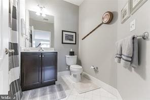 bathroom with toilet and vanity