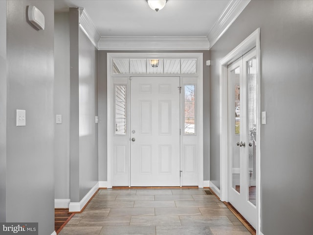 entrance foyer featuring ornamental molding