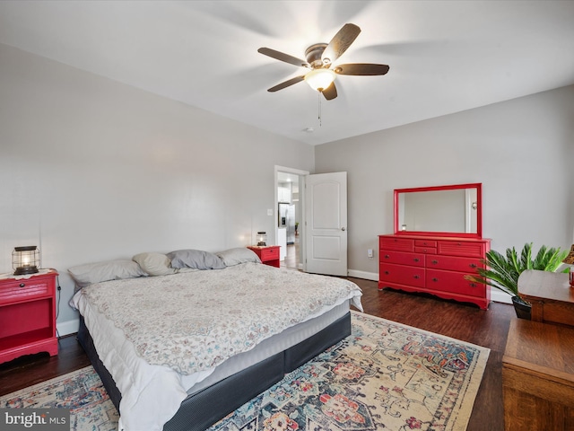 bedroom featuring ceiling fan and dark hardwood / wood-style flooring