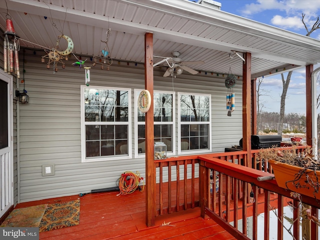 wooden terrace featuring ceiling fan and area for grilling