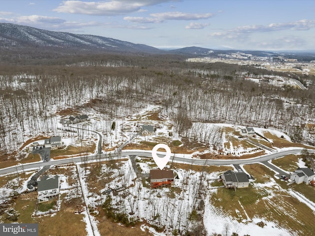 snowy aerial view with a mountain view