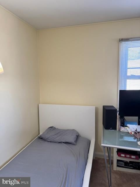 bedroom featuring dark colored carpet