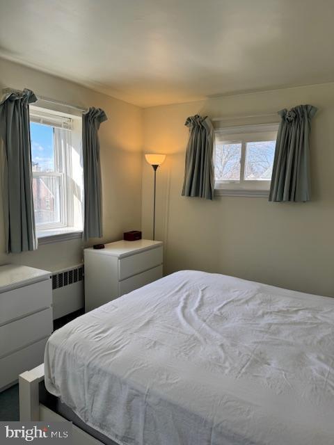 bedroom featuring radiator heating unit