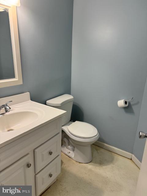 bathroom with toilet and vanity