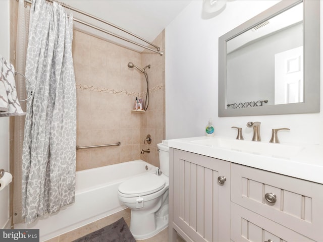 full bathroom with vanity, shower / tub combo with curtain, and toilet