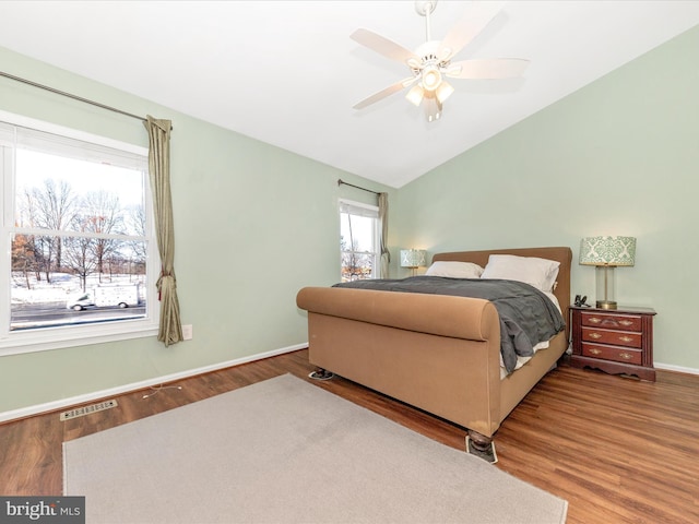 bedroom with vaulted ceiling, hardwood / wood-style floors, and ceiling fan