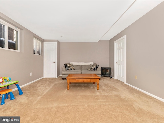 living area featuring light carpet