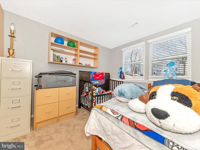 bedroom featuring light colored carpet