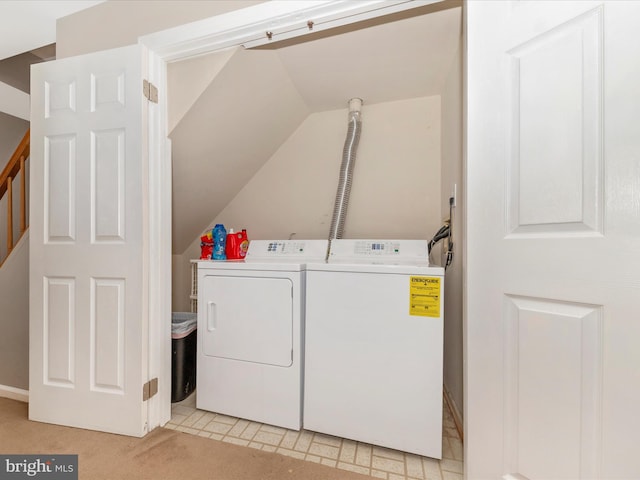 laundry room featuring separate washer and dryer and light carpet