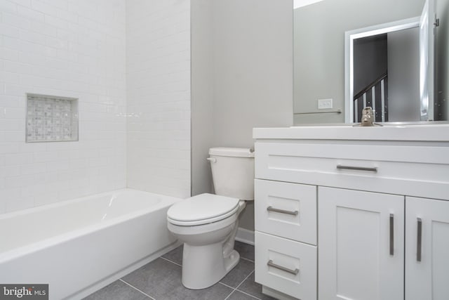 full bathroom with toilet, vanity, tile patterned flooring, and  shower combination