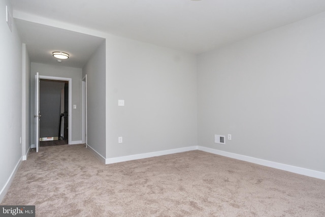 empty room featuring light colored carpet