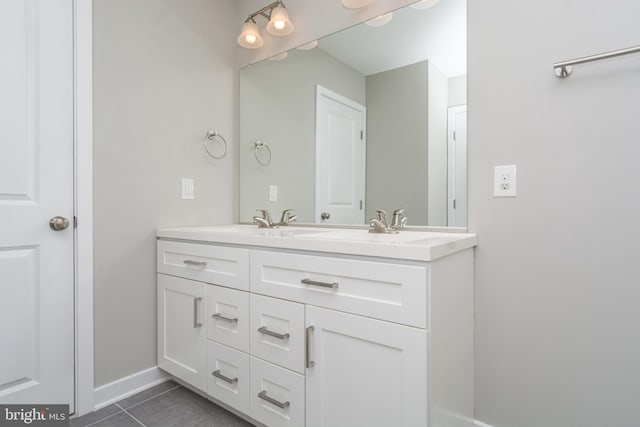 bathroom with vanity and tile patterned flooring