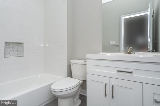 full bathroom featuring toilet, tiled shower / bath combo, and vanity