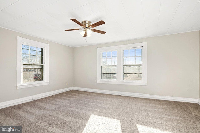 spare room with carpet flooring and ceiling fan