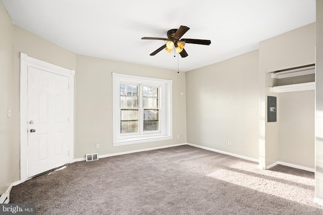 spare room with ceiling fan and carpet flooring