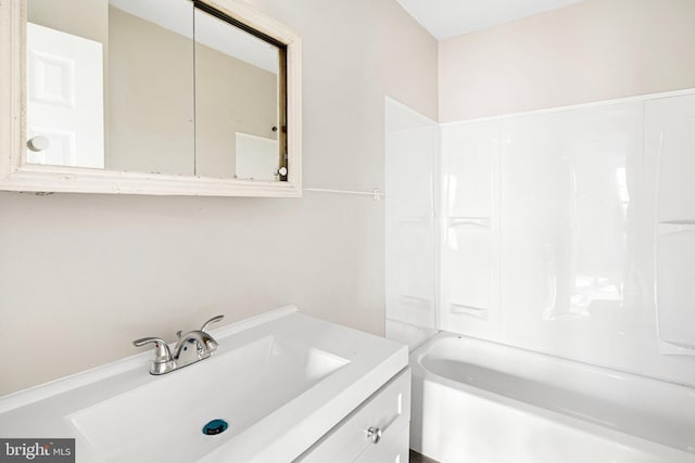 bathroom with shower / bathing tub combination and vanity