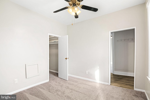 unfurnished bedroom with ceiling fan and light carpet