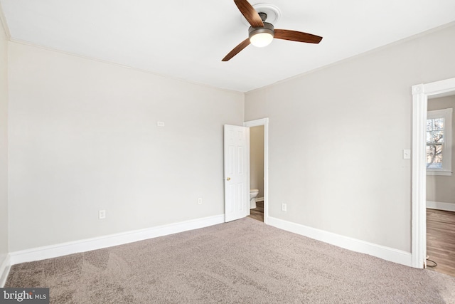 empty room with ceiling fan and carpet