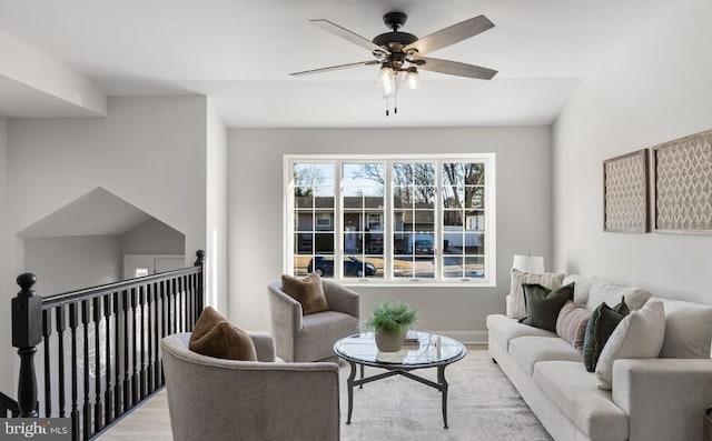 living room with ceiling fan and light hardwood / wood-style floors