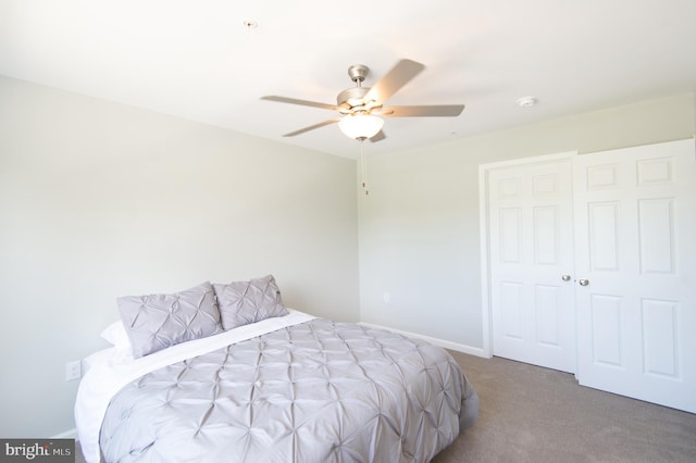 carpeted bedroom featuring ceiling fan