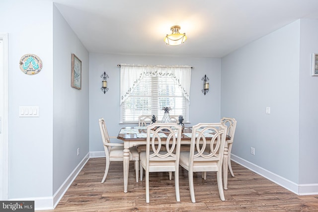 dining room with hardwood / wood-style floors