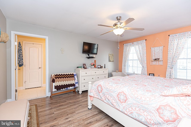 bedroom featuring ceiling fan and light hardwood / wood-style floors