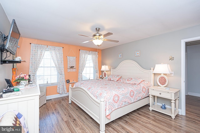 bedroom with ceiling fan and light wood-type flooring