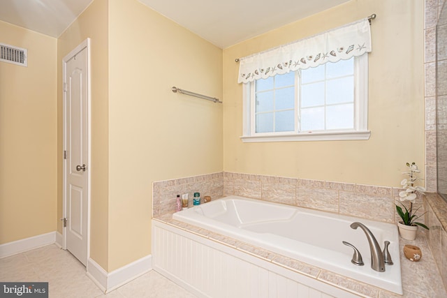 bathroom featuring a bath and tile patterned floors