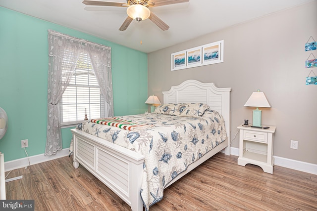 bedroom featuring wood-type flooring and ceiling fan